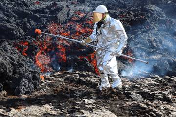 Lukáš Krmíček collecting basalt lava.